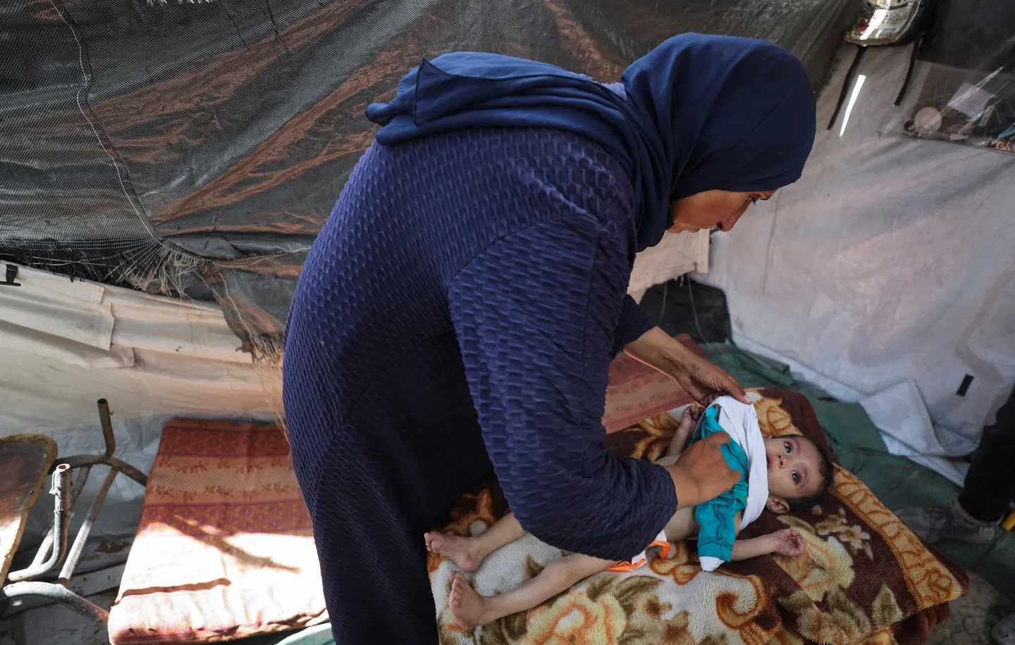 2025_05_29T122423Z_1185252371_RC2WQEAZA6ED_RTRMADP_3_ISRAEL_PALESTINIANS_GAZA_GAZA_CITY_HUNGER