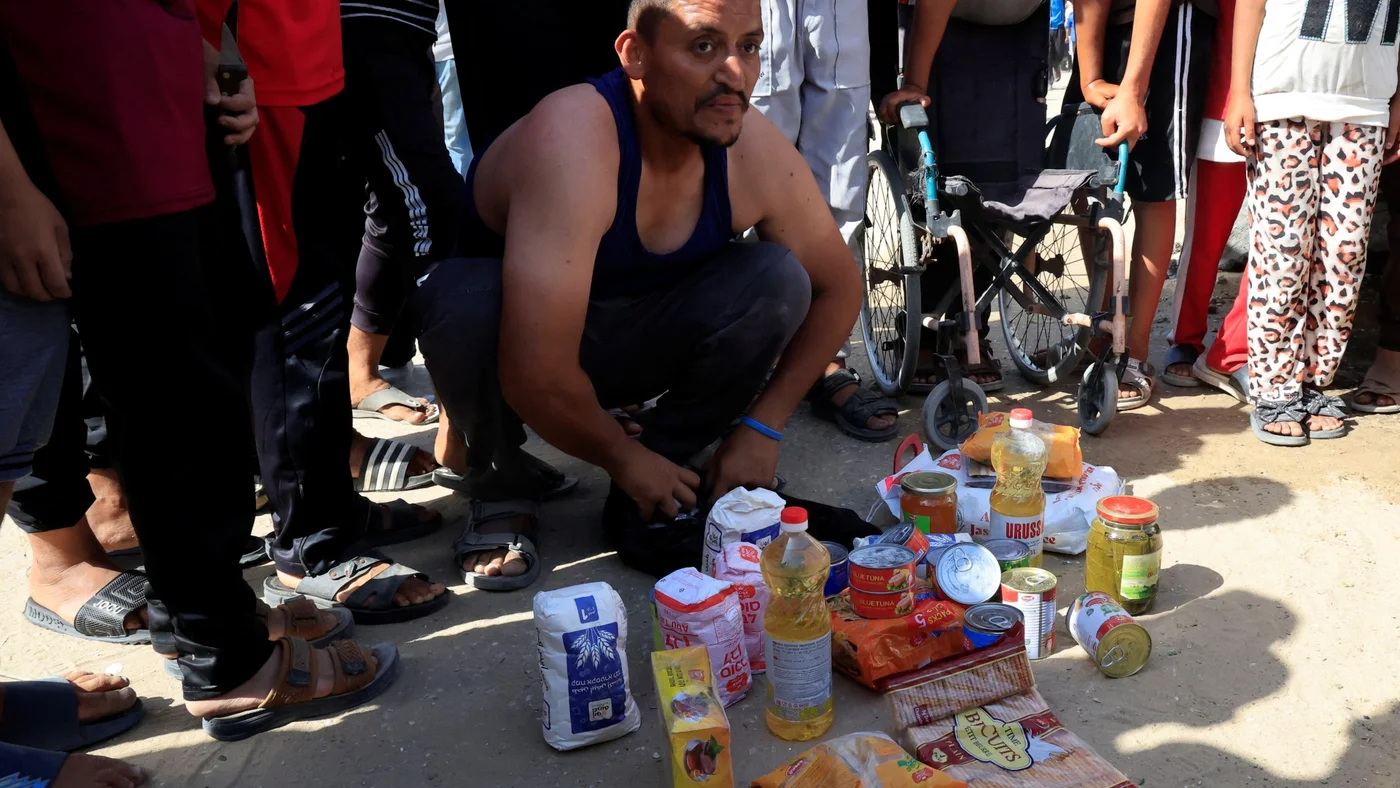 gaza-aid-man-shows-food-received-ghf-27-may-2025-reuters.jpg