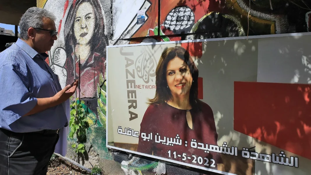 In this picture taken on May 11, 2023, a man visits the spot where Al Jazeera journalist Shireen Abu Akleh was killed on May 11, 2022 while covering an Israeli raid AFP.jpg