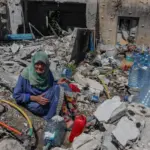 lebanon-woman-rubble-israeli-strikes-reuters-june-2026-tpx-image.jpg