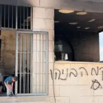 Telepes-támadások hulláma Ciszjordániában: mecseteket, otthonokat és vállalkozásokat vettek célba. Residents inspect the fire-damaged al-Rahma mosque in Qusra, south of Nablus in the occupied West Bank, after an alleged settler arson attack (Muhammed Ateeq Middle East Eye).jpg