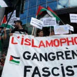 Protesters stand behind a banner reading 22 during a rally against Islamophobia, in Paris on May 11, 2025-afp_0.jpg