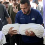 palestine-gaza-mourner-al-shifa-hospital-august-2026-omar-al-qattaa-afp.jpg
