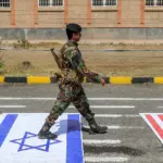 yemen-israel-us-flags-demonstration-sanaa-july-2026-mohammed-huwais-afp.jpg