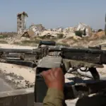 Israeli-soldier-mounted-machine-gun-Gaza-City 3-October-2025-Guez-media-tour-AFP.jpg